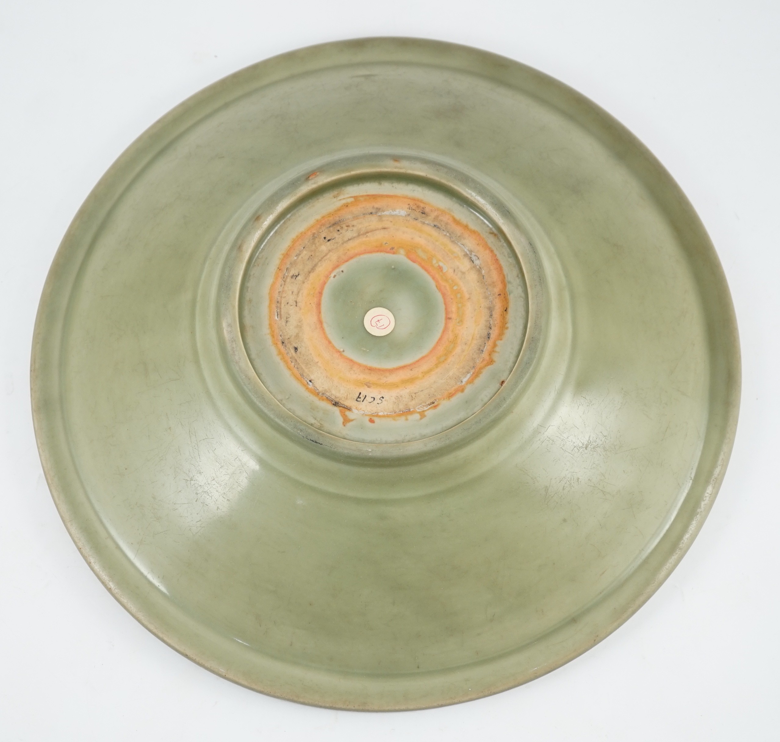 A Chinese Ming Longquan celadon flower moulded dish, 15th century, 34.5cm diameter, scratching to glaze